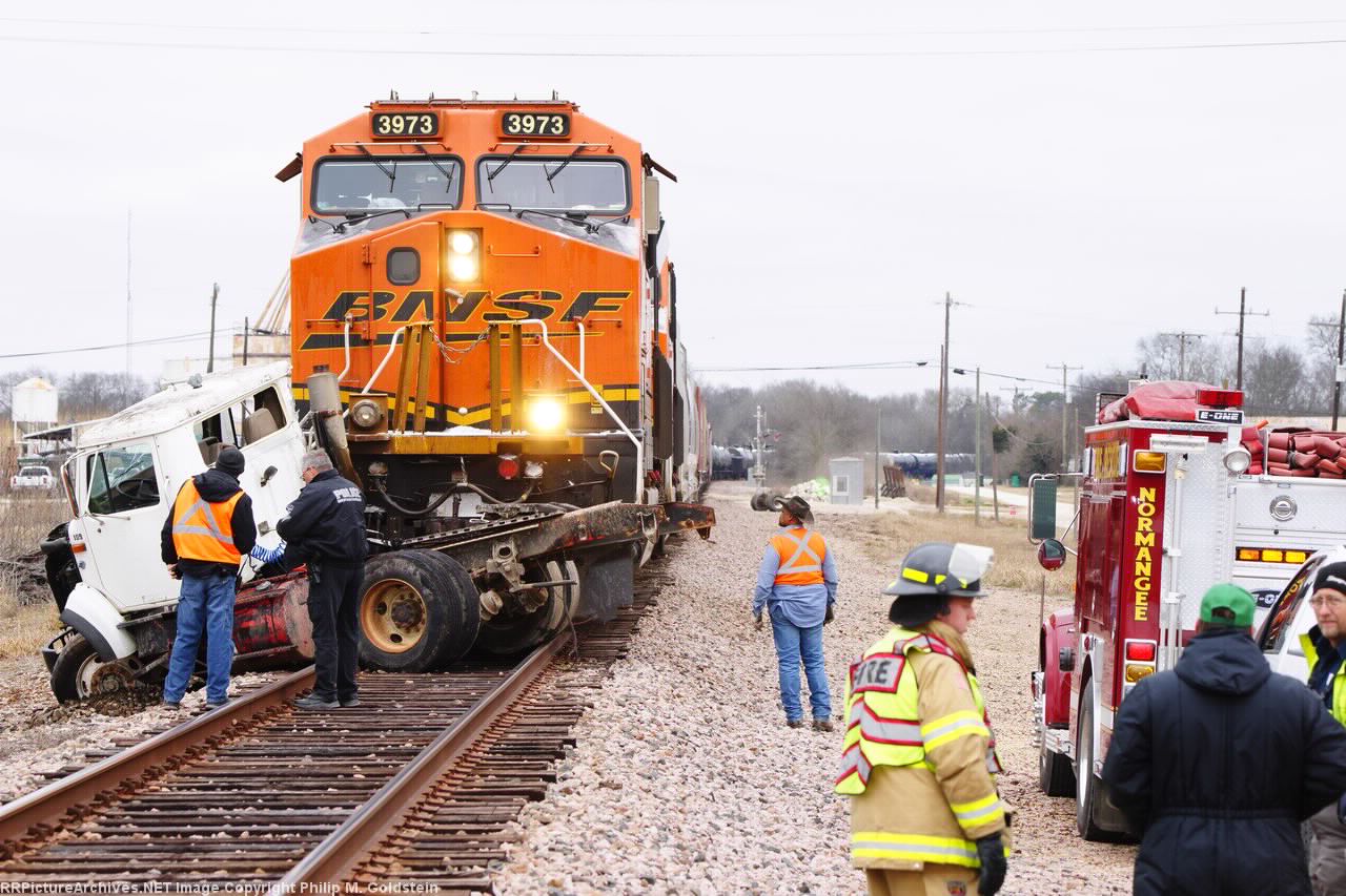 BNSF 3973 - Engineer Mims looking over the damage